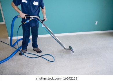 Professional Carpet Steam Cleaner Vacuuming a Home