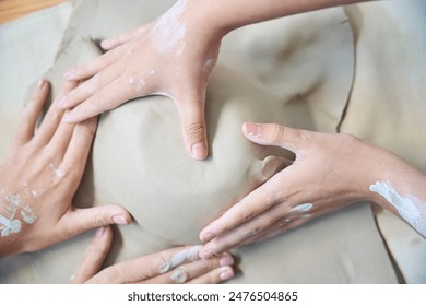 Professional ceramic artist making clay plate in modern pottery workshop - Powered by Shutterstock