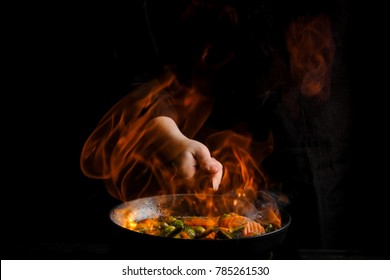 Professional Chef Cooks Flambe Style.