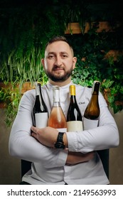 Professional Chef And Sommelier Holding Bottles Of Wine, Wine Culture Concept