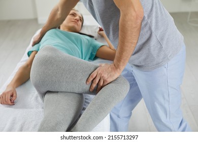 Professional chiropractor, physiotherapist, osteopath or manual therapist helping young woman relieve pain and relax muscles. Physical therapy, physiotherapy, pain treatment, rehabilitation concept - Powered by Shutterstock