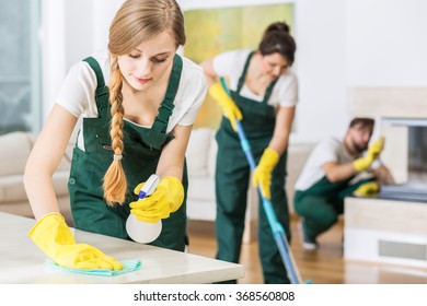 Professional Cleaning Service In Uniforms During Work