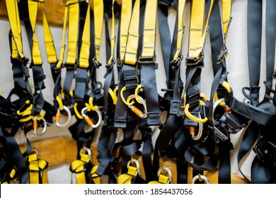 Professional climbing equipment hanging at amusement park warehouse - Shutterstock ID 1854437056