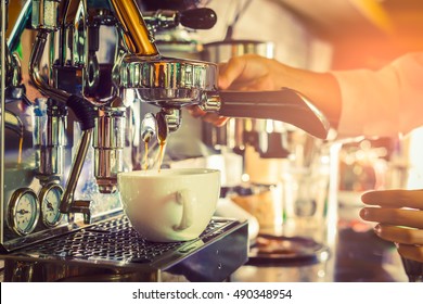 Professional coffee machine making espresso in a cafe - Powered by Shutterstock