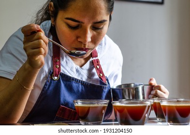 Professional coffee taster testing new smells and flavors - Powered by Shutterstock