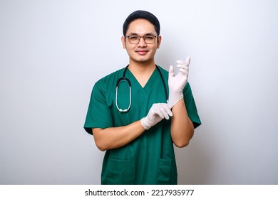 Professional and confident smiling asian physician, nurse wear rubber gloves and stethoscope for patient examination, looking at camera isolated over white background - Powered by Shutterstock