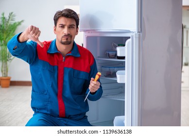 Professional Contractor Repairing Broken Fridge