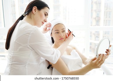     
professional cosmetologist consults his patient in the office of aesthetic medicine and cosmetology                           