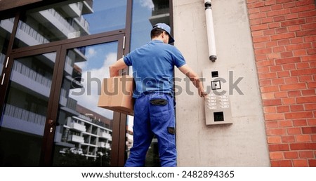 Professional courier using advanced intercom system for secure deliveries at building entrance, ensuring packages are delivered with identity verification.