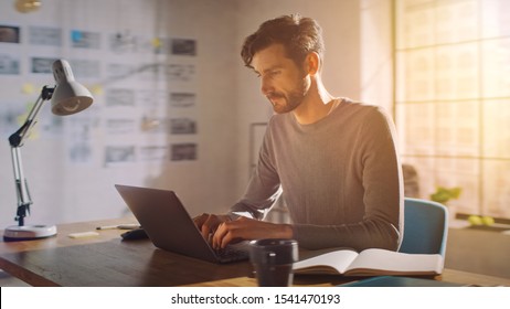 Professional Creative Man Sitting At His Desk In Home Office Studio Working On A Laptop, Concentrated Man Using Notebook Computer.