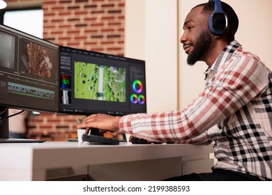 Professional Creator Using Software To Edit Video Footage On Multiple Monitors At Home, Editing Movie With Production Application On Computer. Working On Film Montage To Create Media Content.