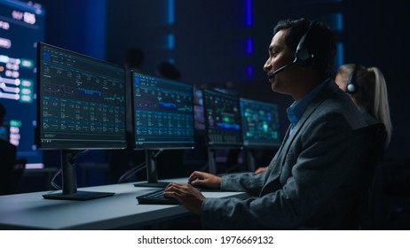 Professional Customer Support Specialist Wearing Headset Talks with Client and Works on Computer in Big Call Center Control Room. Team of Sales Representatives Service Providers Talk with Investors - Powered by Shutterstock