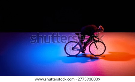Professional cyclist accelerating in neon gradient racing setup. Concept of elite performance, speed culture, sport innovation and high-impact visual content for global sport brands.