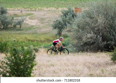 Professional Cyclist Training Offroad Riding In Fields, Bicycle Rider Alone Outdoor 