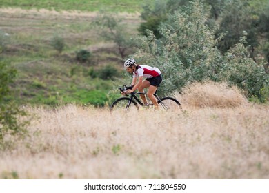 Professional Cyclist Training Offroad Riding In Fields, Bicycle Rider Alone Outdoor 