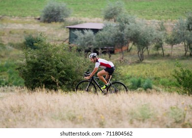 Professional Cyclist Training Offroad Riding In Fields, Bicycle Rider Alone Outdoor 