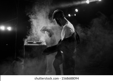 Professional Dancers - Young White Guys In Masks Is Dancing Emotional Inflammatory Club Dance On Stage During A Dubstep Party, DJ, Black And White, Rhythm, Tempo, Movement, Happiness, Performance, PJ