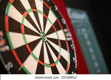A Professional Dart Board with a Slate Chalkboard in the Background - Shutterstock ID 107183012