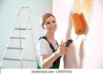 Professional Decorator Painting Wall Indoors. Home Repair Service