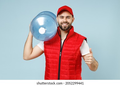 Professional Delivery Guy Employee Man In Red Cap White T-shirt Vest Uniform Workwear Work As Dealer Courier Hold Water Bottle Isolated On Pastel Blue Color Background Studio Portrait. Service Concept