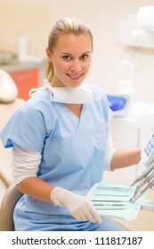 Professional dental staff with medical tools sitting at surgery office