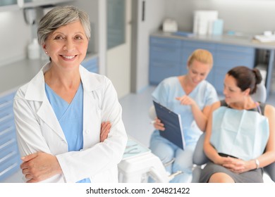 Professional Dentist Woman Patient Consultation With Assistant At Dental Surgery