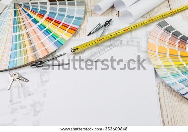 Professional designer architect work place table. RAL
colors set, ruler, dividers, drawings, draft, plan, dft. Top view
work space. 