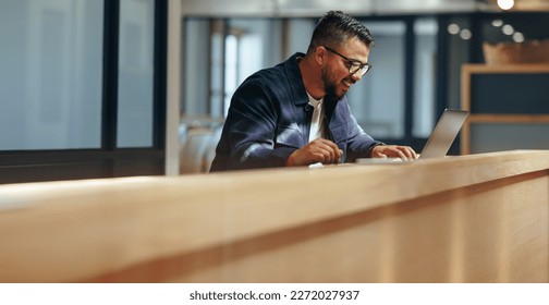 Professional designer drawing on a graphics tablet in a cafe. Creative business man working on a new design with a laptop. Freelance web designer working remotely. - Powered by Shutterstock