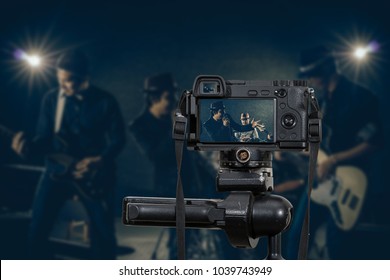 Professional Digital Mirrorless Camera With Microphone Recording Video Blog Of Musician Band Singing A Song And Playing Music Instrument,Camera For Photographer Or Video And Live Streaming Concept