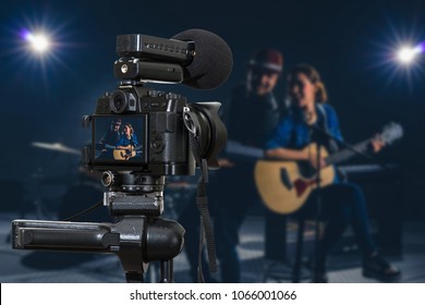 Professional Digital Mirrorless Camera With Microphone Recording Video Blog Of Musician Duo Band Singing A Song And Playing Music Instrument,Camera For Photographer Or Video And Live Streaming Concept