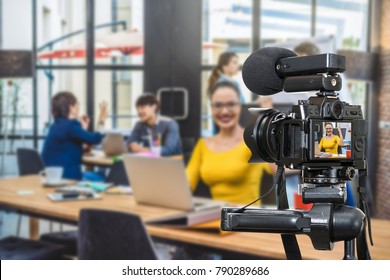 Professional digital Mirrorless camera with microphone recording video blog of Businesswoman working with Group Of Business people , Camera for photographer or Video and Live Streaming concept - Powered by Shutterstock