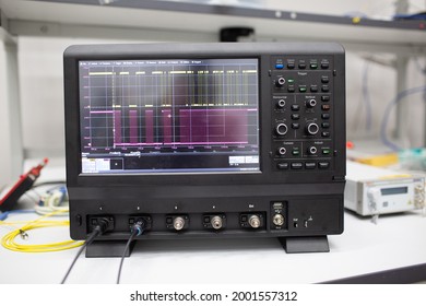 Professional digital oscilloscope oscillograph at tech lab.