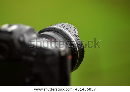 professional digital photo camera in the rain