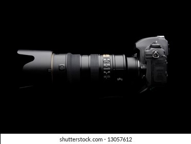 Professional Digital Photo Camera With Zoom Lens On Black Background