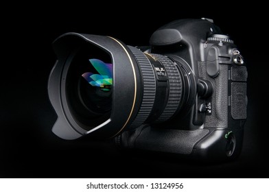 Professional Digital Photo Camera With Zoom Lens On Black Background