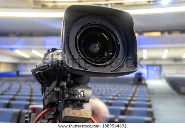 Professional digital video camera. tv camera in a\
concert hal.
