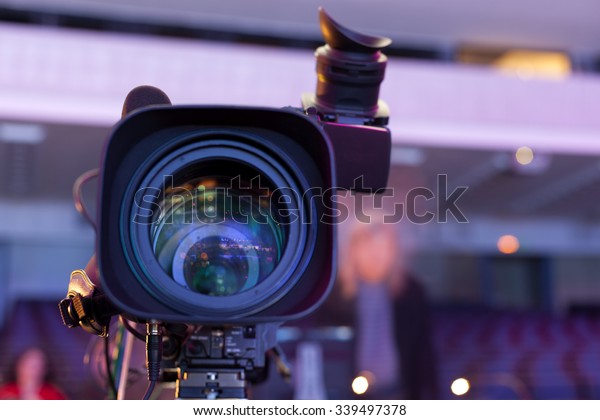 Professional digital video camera. tv camera in a\
concert hal. \
Digital TV\
camera