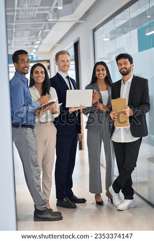 Professional diverse international team young business people workers standing in corporate office, happy multiethnic smiling employees colleagues company staff team vertical portrait together.