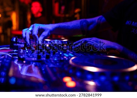Professional dj mixer controller with lights at nightclub party close up