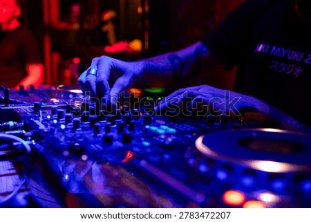Professional dj mixer controller with lights at nightclub party close up
