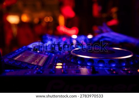 Professional dj mixer controller with lights at nightclub party close up