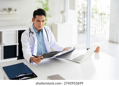 Professional doctor doing paperwork checking medical documents at workplace. Concentrated physician reading medic form analyzing patient diagnosis or report in hospital.