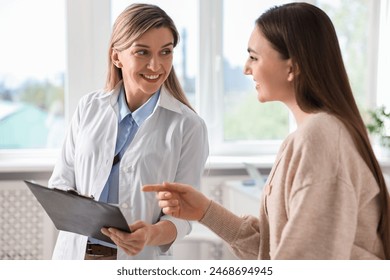 Professional doctor working with patient in hospital - Powered by Shutterstock