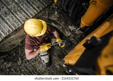 Professional Dozer Operator Worker Lubricating Greasing Points Inside A Heavy Equipment Crawler Machine. Bulldozer Grease Maintenance.