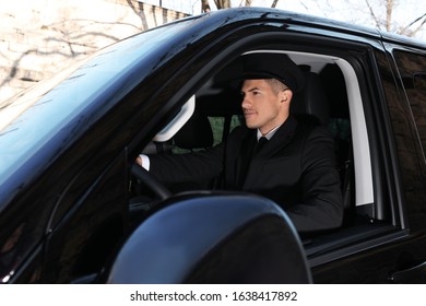 Professional Driver In Luxury Car. Chauffeur Service