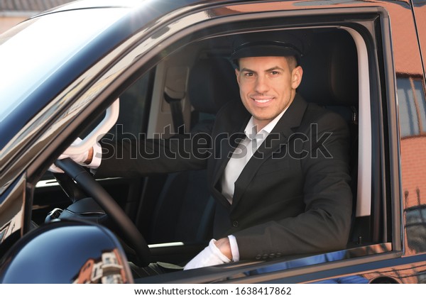 Professional\
driver in luxury car. Chauffeur\
service