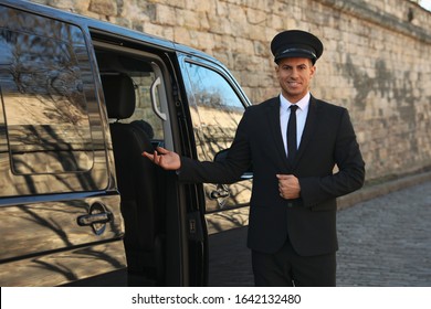 Professional Driver Near Luxury Car Outdoors. Chauffeur Service