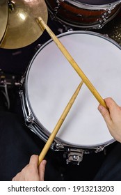 Professional Drum Set Closeup. Man Drummer With Drumsticks Playing Drums And Cymbals, On The Live Music Rock Concert Or In Recording Studio   