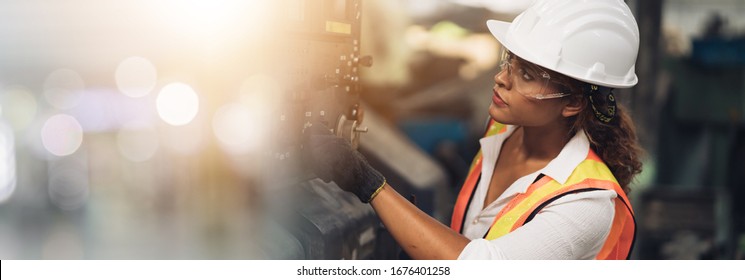 Professional engineer black women , worker, woman afican mechanical, maintenance, check in factory, warehouse Workshop for factory operators, engineering women training. Business factory. - Shutterstock ID 1676401258
