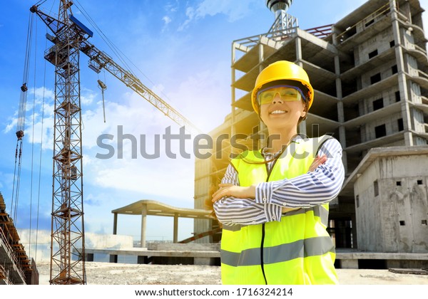 Professional engineer in safety equipment at\
construction site